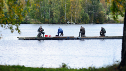 Four men fishing on the pier.