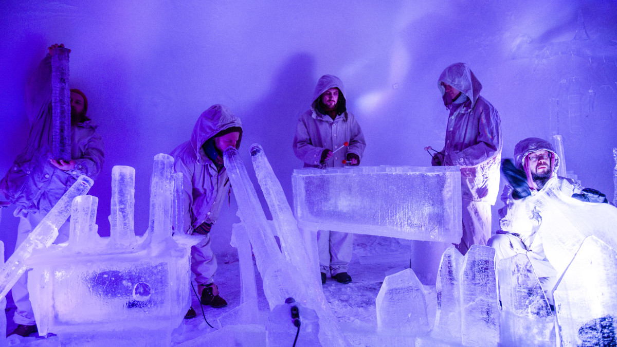 Men playing instruments made of ice.
