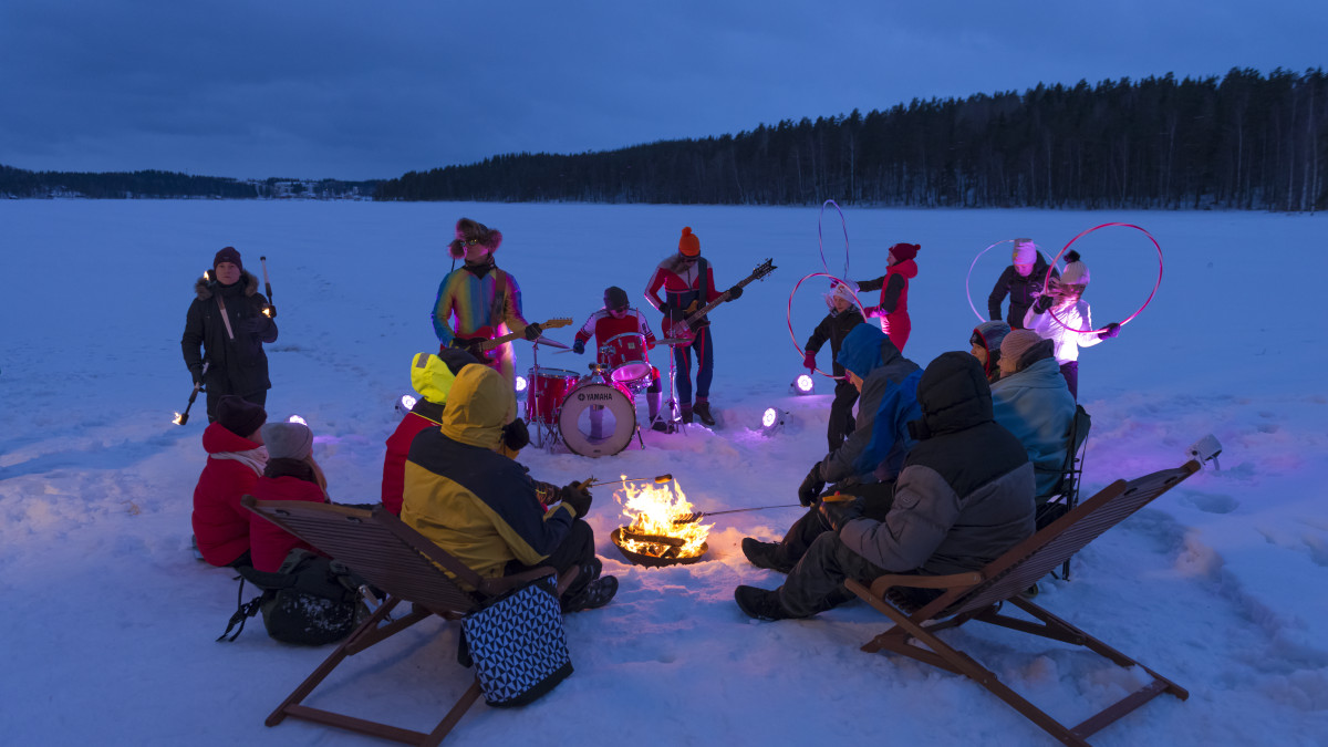 People at the evening campfire in winter.