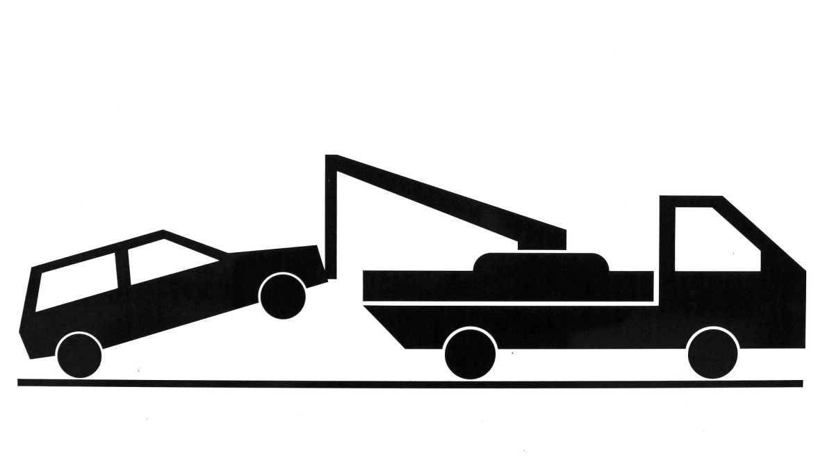 A car is being towed in the black and white drawing.