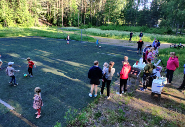 People on a summer soccer field.