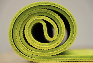 Yoga mat on a roll.