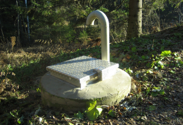 Domestic water well in the forest.