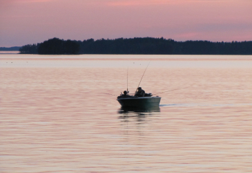 Fisherman in the evening in Saimaa
