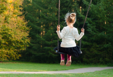 A child on a swing.