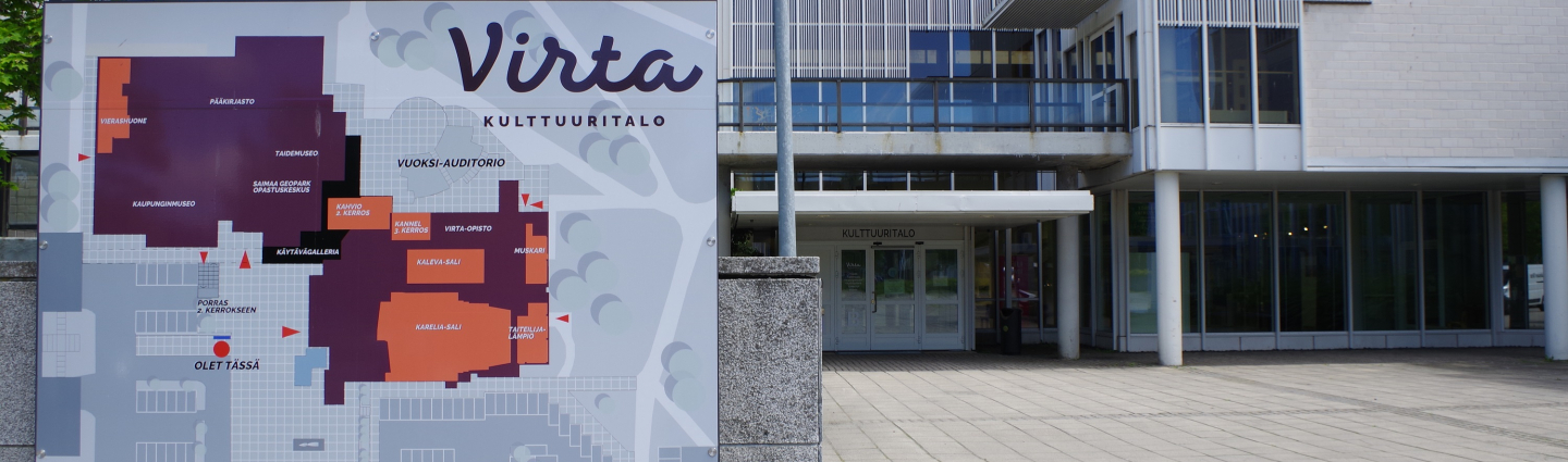 Kulttuuritalo Virran opastekyltti ja kirjaston sisäänkäynti.