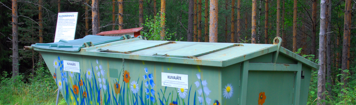 A large waste pallet decorated with flowers.