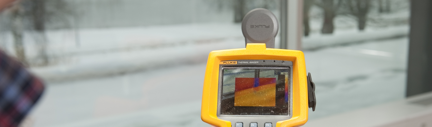 A person uses a thermal camera.
