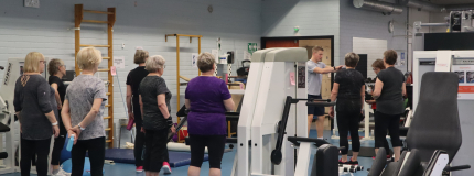 A group of elderly people at the gym.