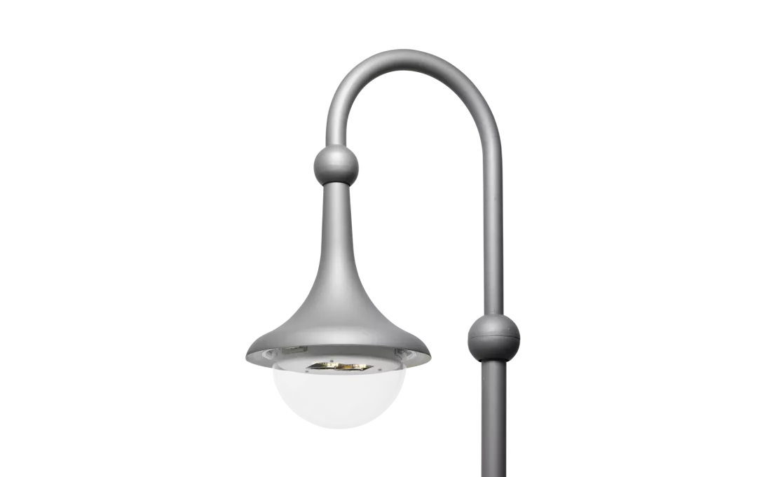 Curved steel gray street lamp with a glass cover.